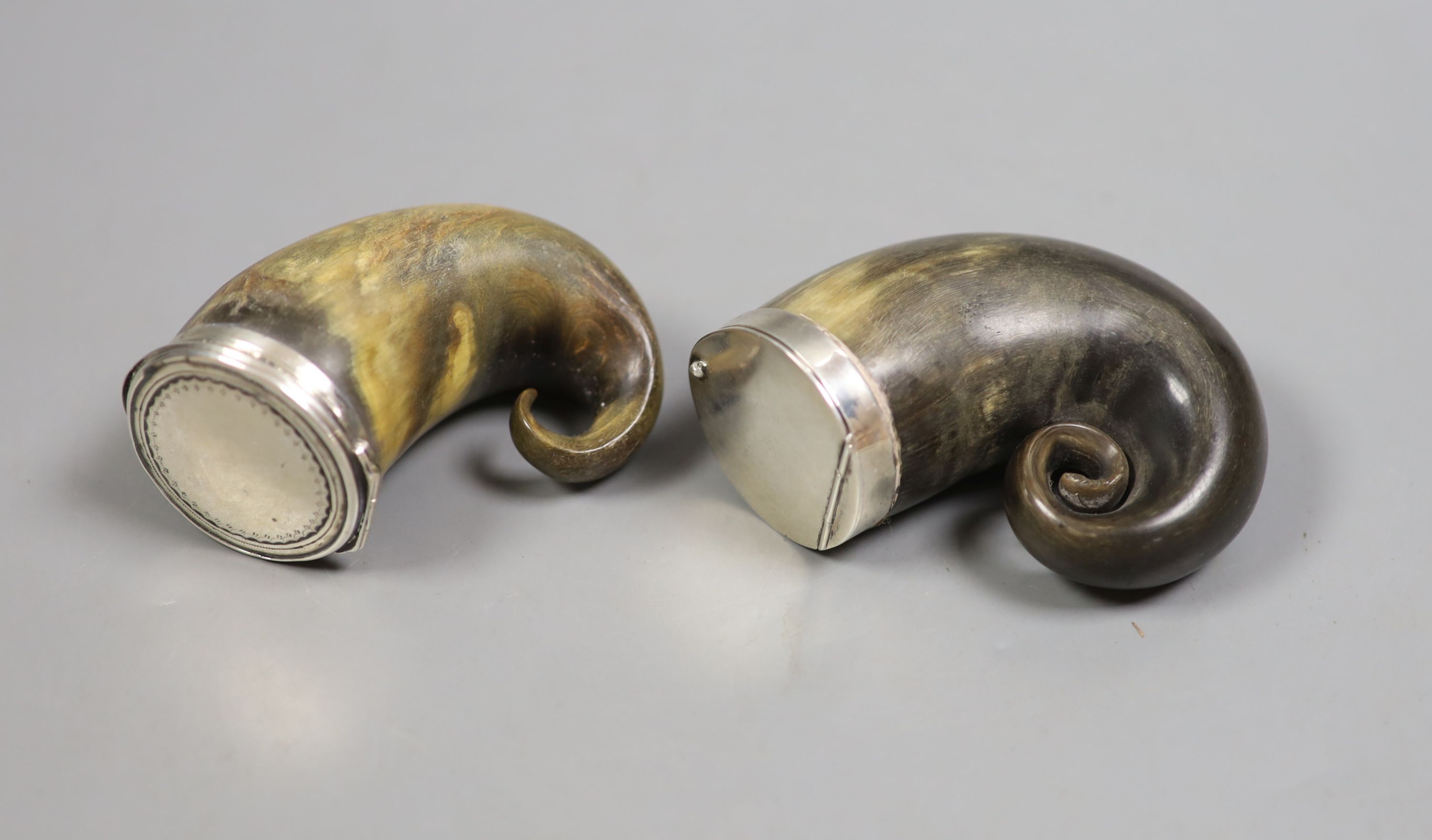 Two 19th/early 20th century white metal mounted horn snuff mulls, one hallmarked for London, 1904, largest 72mm.